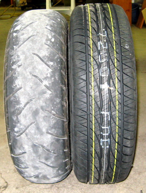 Side-by-side motorcycle tire and car tire showing different tread shapes